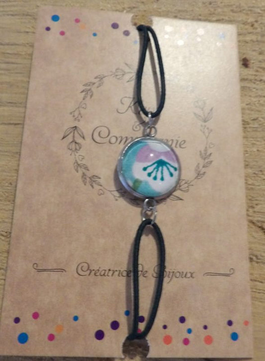 Bracelet élastique couleur verte avec cabochon 14mm - papier japonais fond bleu et fleur blanche et violette