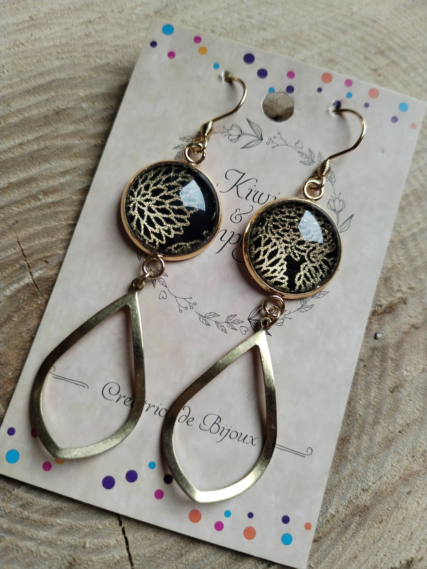 Boucles d'oreilles longues noires et dorées