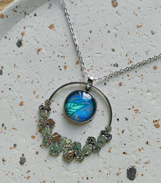 Collier acier  bleu fleur et breloque ronde