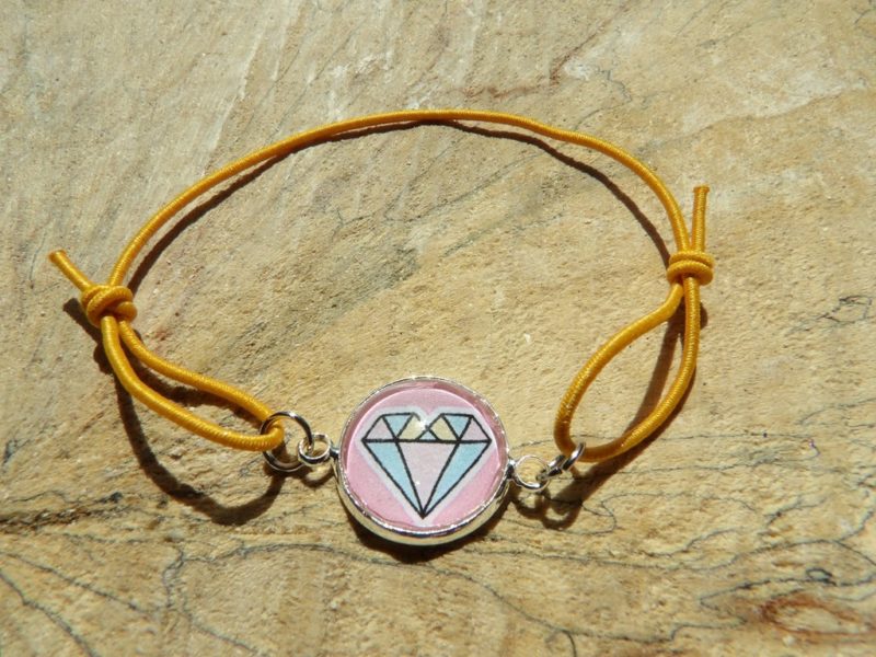 Bracelet élastique orange avec cabochon diamant fond rose 14mm