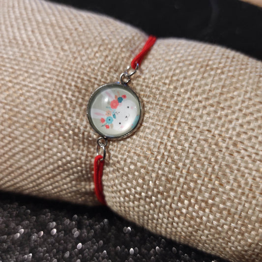 Bracelet élastique couleur rouge avec cabochon 14mm - lapin